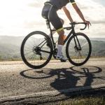 cyclist sports on road sun rays and shadows from 2021 09 01 23 03 46 utc